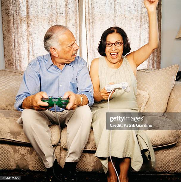 woman celebrating defeat of husband - defeat funny stock pictures, royalty-free photos & images