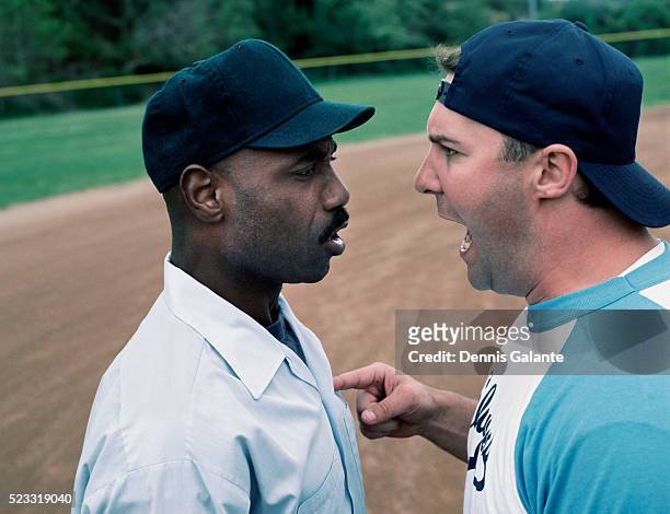 softball player arguing with umpire - softball sport stock-fotos und bilder