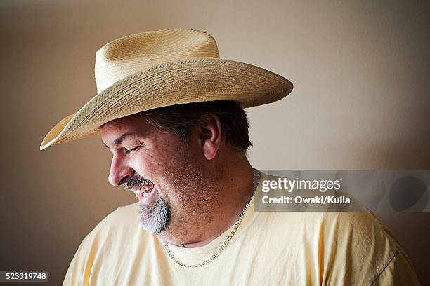 man wearing straw hat - marfa texas stock pictures, royalty-free photos & images