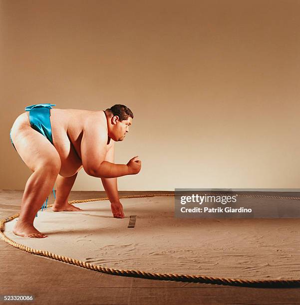 sumo wrestler preparing to fight - sumo stock pictures, royalty-free photos & images