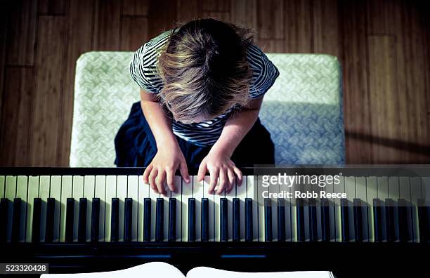 young girl (10-12) playing piano, grand junction, colorado, usa - ピアノ ストックフォトと画像