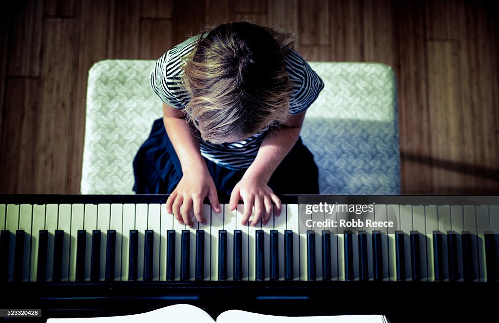 Young girl (10-12) playing piano, Grand Junction, Colorado, USA