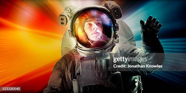 astronaut floating in space - astronaut helm stock-fotos und bilder