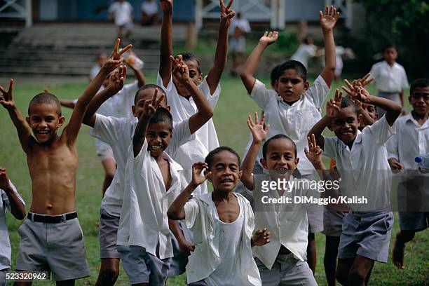 school boys cheering in victory - fiji people stock pictures, royalty-free photos & images