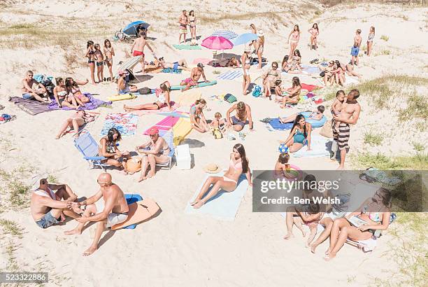 people at the beach. tarifa, cadiz, costa de la luz, andalusia, southern spain. - crowded beach stock pictures, royalty-free photos & images