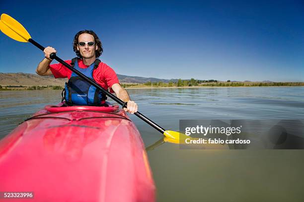 man kayaking - sea kayaking stock-fotos und bilder