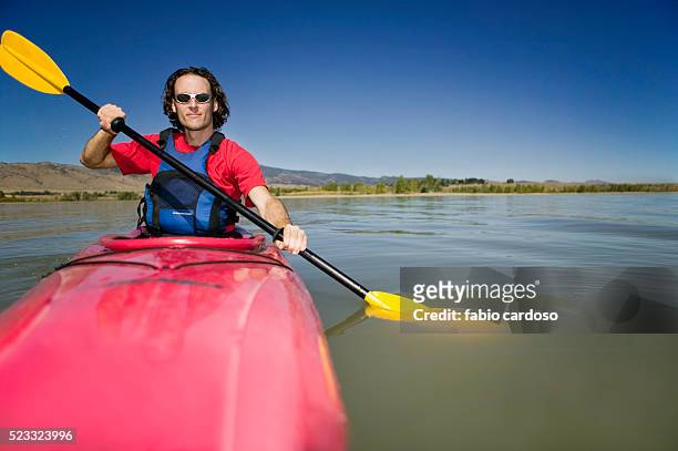 man kayaking - sea kayaking imagens e fotografias de stock