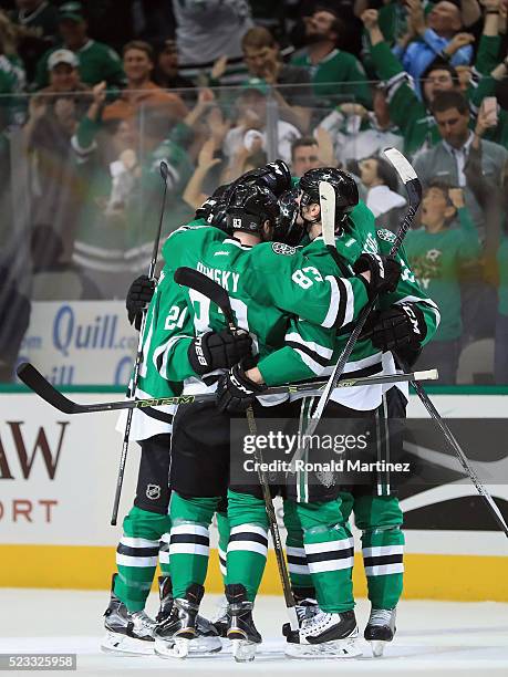 The Dallas Stars celebrate a goal by Johnny Oduya against the Minnesota Wild in the first period in Game Five of the Western Conference First Round...