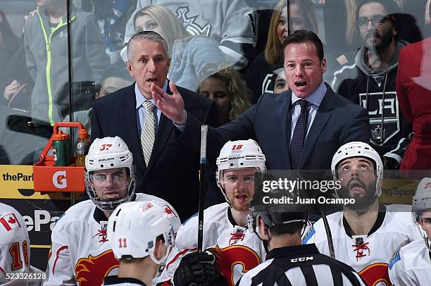 Assistant Coach Martin Gelinas and head coach Bob Hartley of the Calgary Flames argue a call with the referee during the game against the Los Angeles...