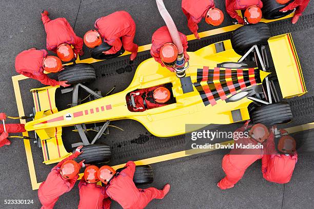 open-wheel single-seater racing car racecar in pit box during pit stop - pitstop team stock pictures, royalty-free photos & images