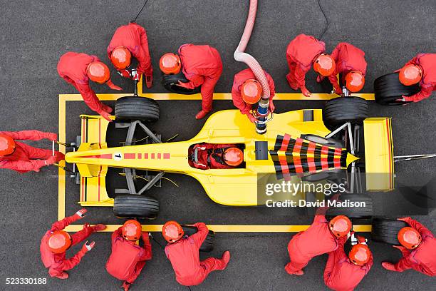 open-wheel single-seater racing car racecar in pit box during pit stop - pit stop top view stock pictures, royalty-free photos & images