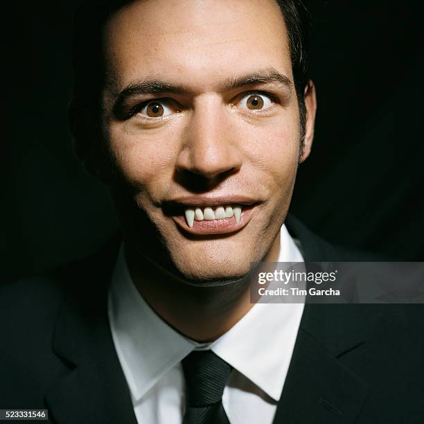 businessman with vampire teeth - vampir stock-fotos und bilder