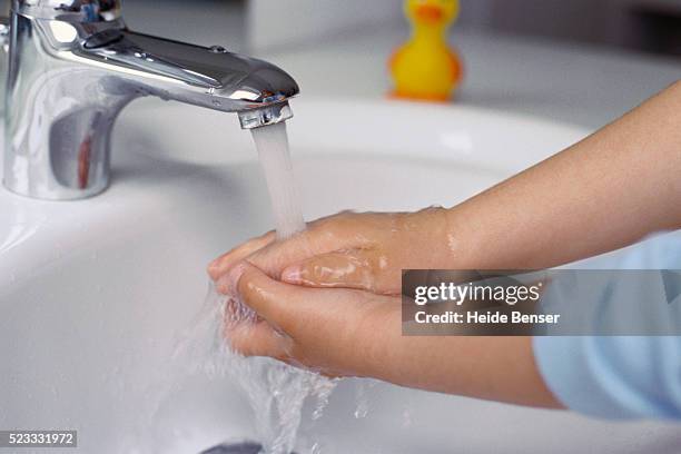 little girl washing hands - child washing hands stock pictures, royalty-free photos & images