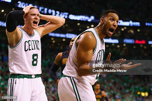 Jonas Jerebko of the Boston Celtics and Evan Turner react after a foul was called against Turner during the fourth quarter of Game Three of the...