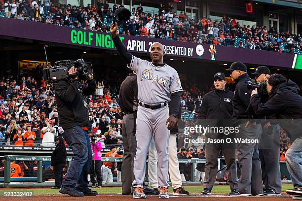 Barry Bonds of the Miami Marlins waves his cap after presenting a lineup card before the game against the San Francisco Giants at AT&T Park on April...