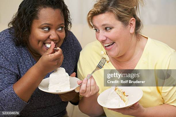 women eating cake - haitian cake stock pictures, royalty-free photos & images