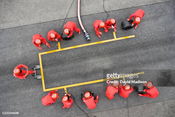 pit crew ready for pit stop - pit stop stock pictures, royalty-free photos & images