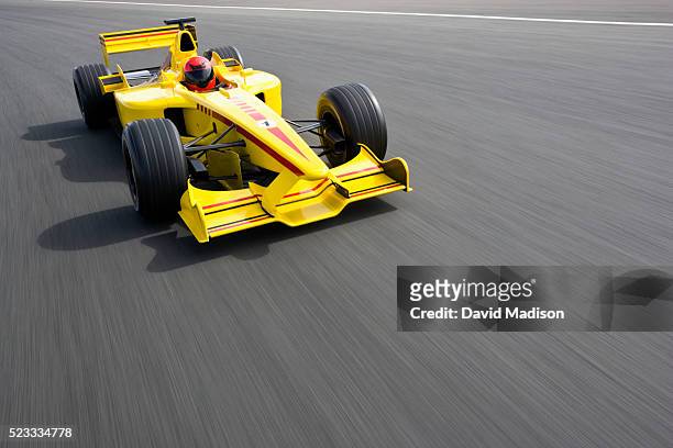 open-wheel single-seater racing car racecar speeding down racetrack - race car driver stock pictures, royalty-free photos & images