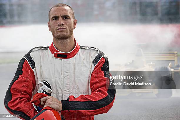 racecar driver leaving racecar with mechanical breakdown - racerförare bildbanksfoton och bilder