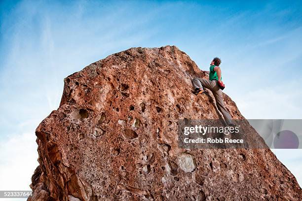 rock climber climbing boulder - robb reece stock pictures, royalty-free photos & images