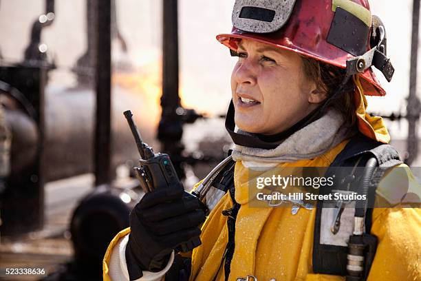 firefighter using walkie-talkie - walkie talkie imagens e fotografias de stock