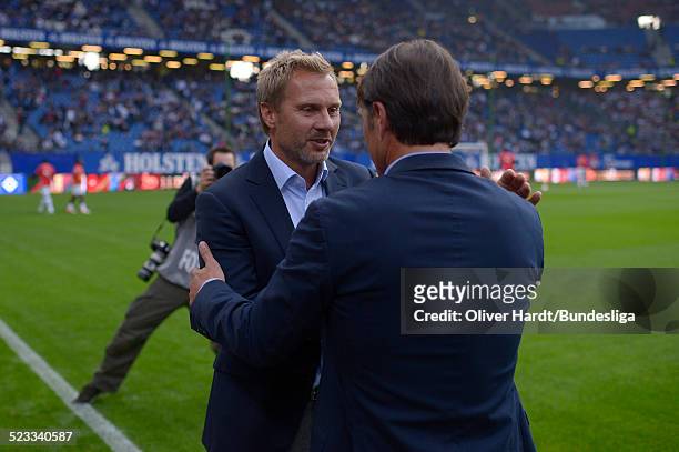 Head coach Thorsten Fink of Hamburg and Head coach Bruno Labbadia of Stuttgart shake hands before during Bundesliga match between Hamburger SV v VfB...