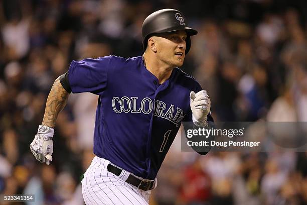 Brandon Barnes of the Colorado Rockies rounds the bases on his game winning two RBI triple off of Chris Hatcher of the Los Angeles Dodgers to take a...