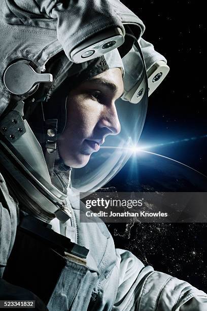 astronaut floating in space - astronaut stock pictures, royalty-free photos & images