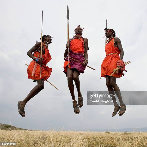 three maasai warriors jumping - native african ethnicity stock pictures, royalty-free photos & images