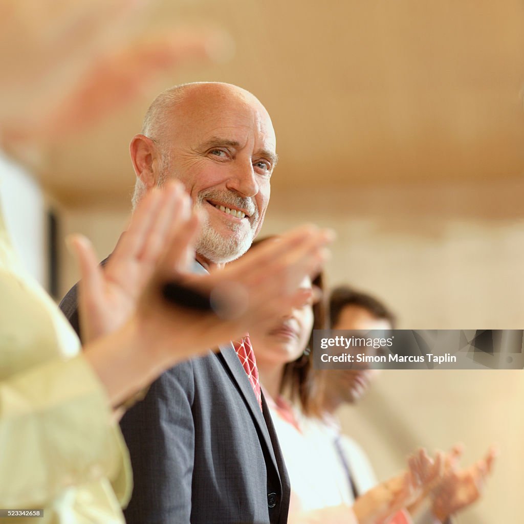 Businesspeople Applauding Conference Speaker