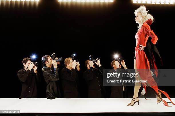 photographing model at fashion show - runway stockfoto's en -beelden