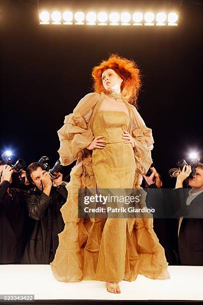 photographing fashion model on runway - fashion show model stock pictures, royalty-free photos & images
