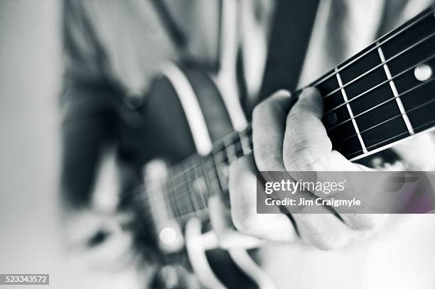 man playing guitar - jim craigmyle guitar stock pictures, royalty-free photos & images