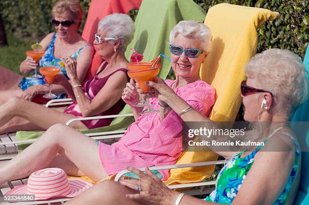 senior friends toasting drinks - 4 cocktails stock pictures, royalty-free photos & images