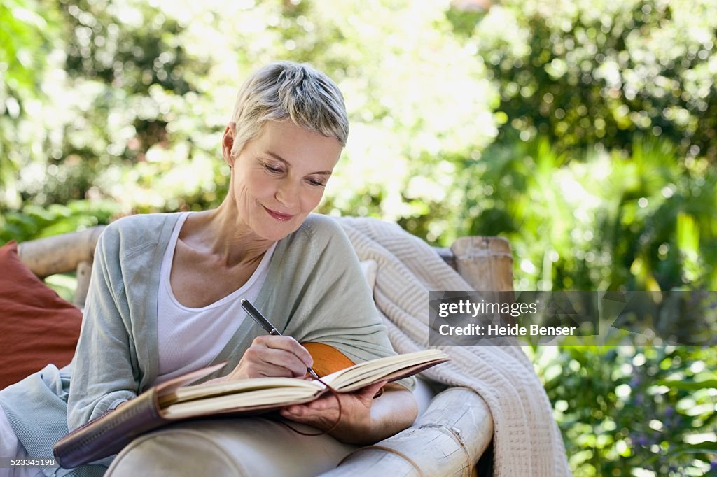 Woman writing in a journal