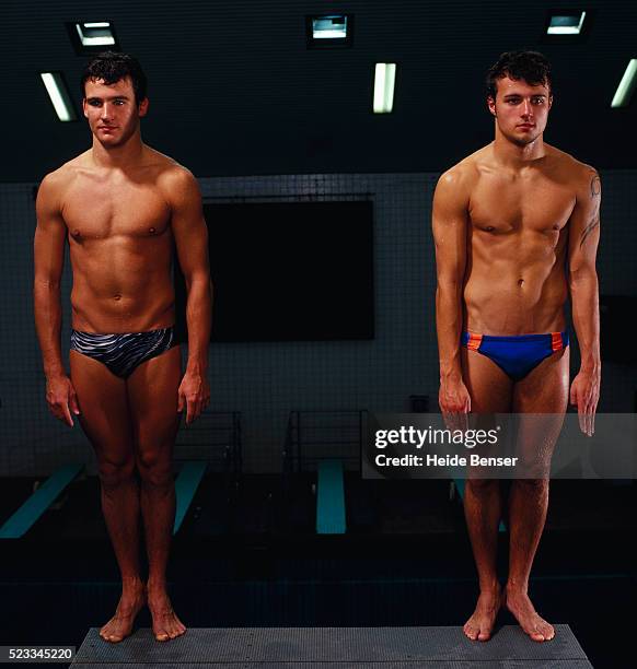 two men on diving platform - diving platform stock pictures, royalty-free photos & images