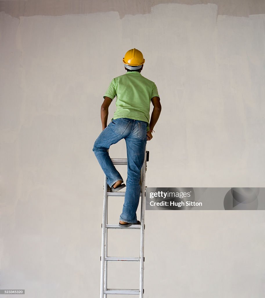 Worker Climbing Ladder High-Res Stock Photo - Getty Images