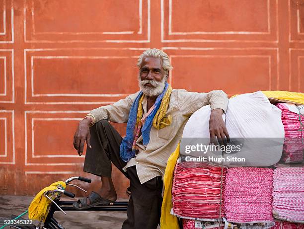 man transporting fabric with bicycle - hugh sitton india fotografías e imágenes de stock