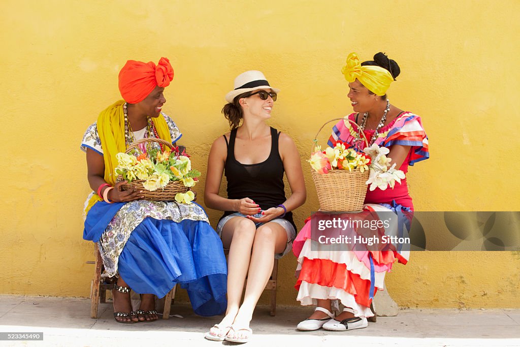 Tourists with Flower Ladies. Havana. Cuba.