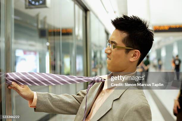 clumsy businessman - clumsy stock pictures, royalty-free photos & images