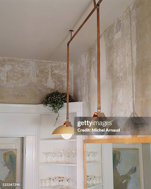 tennessee traditional horse farm: hanging lamps of copper pipe - pendant light stock pictures, royalty-free photos & images