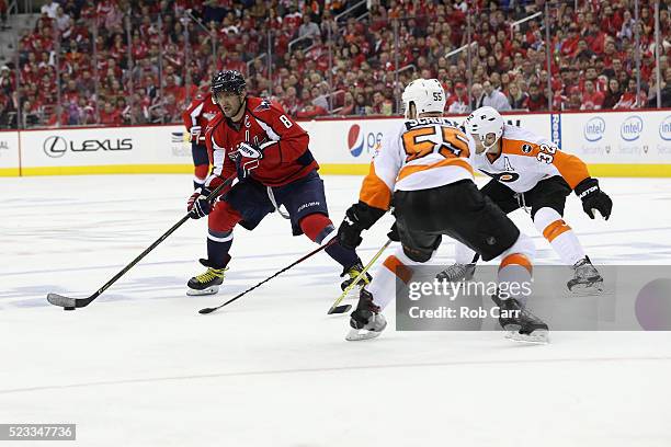 Alex Ovechkin of the Washington Capitals passes the puck in front of Samuel Morin of the Philadelphia Flyers during Game Five of the Eastern...