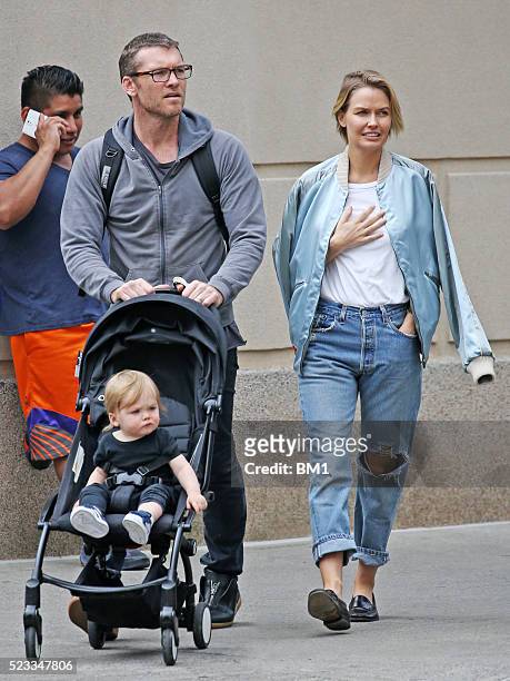 Sam and Lara Worthington and their son, Rocket stroll through Manhattan on April 22, 2016 in New York City.