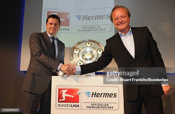 Christian Seifert, chairman of business for the DFL and Hanjo Schneider, CEO of Hermes europe at the announcement of Hermes as the new DFL premium...