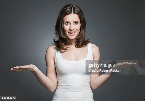 woman making uncomprehending gesture - tank top ストックフォトと画像