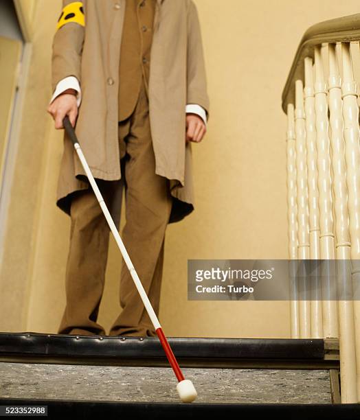 blind man walking down stairs - blind man stockfoto's en -beelden