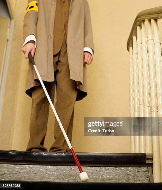 blind man walking down stairs - blind man stock pictures, royalty-free photos & images