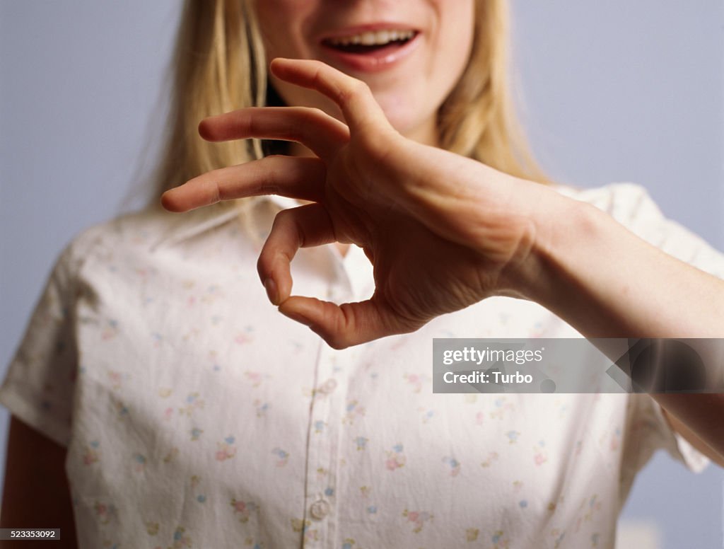 Young Woman Signing "Good"