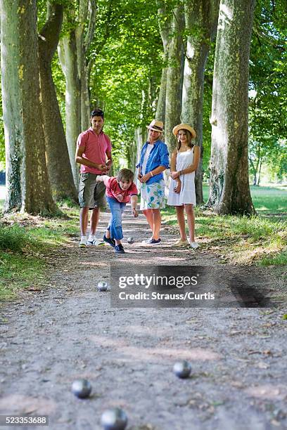 family playing boule - boule stock pictures, royalty-free photos & images