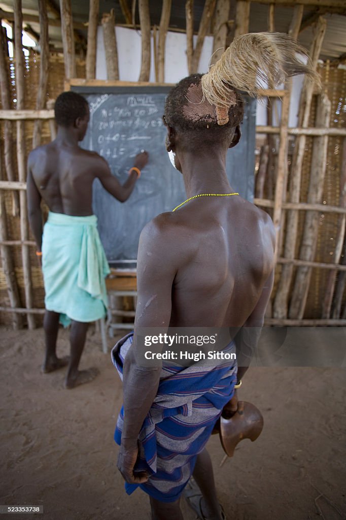 School Teacher Teaching Karo Tribesman